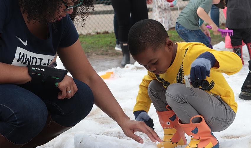 Mom and son making snow balls